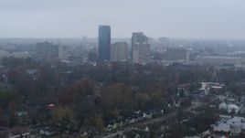 5.7K aerial stock footage flying by the city skyline seen from residential neighborhoods, Downtown Lexington, Kentucky Aerial Stock Footage | DX0001_003206