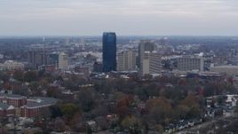 5.7K aerial stock footage focus on the city's skyline from tree-lined neighborhoods, Downtown Lexington, Kentucky Aerial Stock Footage | DX0001_003214