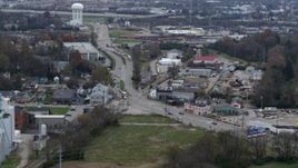 5.7K aerial stock footage passing a busy street in industrial area near water tower in Lexington, Kentucky Aerial Stock Footage | DX0001_003222