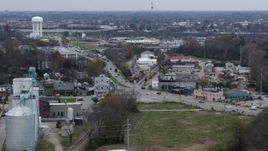 5.7K aerial stock footage reverse view of a busy street and railroad tracks in industrial area and descend in Lexington, Kentucky Aerial Stock Footage | DX0001_003225