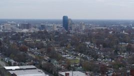 5.7K aerial stock footage ascend from neighborhood and focus on city skyline, Downtown Lexington, Kentucky Aerial Stock Footage | DX0001_003226
