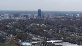 5.7K aerial stock footage of city skyline while flying by houses, Downtown Lexington, Kentucky Aerial Stock Footage | DX0001_003230