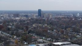 5.7K aerial stock footage of city skyline while flying by tree-lined neighborhoods, Downtown Lexington, Kentucky Aerial Stock Footage | DX0001_003231
