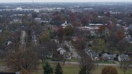 5.7K aerial stock footage church steeple behind suburban neighborhood in Lexington, Kentucky Aerial Stock Footage | DX0001_003234