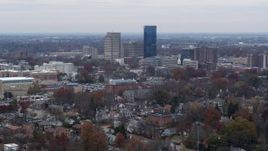 5.7K aerial stock footage of flying by skyscrapers in the city skyline, seen from neighborhoods, Downtown Lexington, Kentucky Aerial Stock Footage | DX0001_003244
