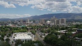 5.7K aerial stock footage of hotels and casinos seen while passing north of the city in Reno, Nevada Aerial Stock Footage | DX0001_004_024