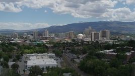 5.7K aerial stock footage of descending with a view of the hotels and casinos in the city's skyline in Reno, Nevada Aerial Stock Footage | DX0001_004_035