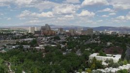 5.7K aerial stock footage of flying by the city's skyline, seen from west of the city in Reno, Nevada Aerial Stock Footage | DX0001_004_038
