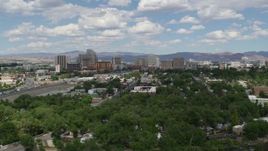 5.7K aerial stock footage of hotels and casinos of the city's skyline, seen from trees west of the city in Reno, Nevada Aerial Stock Footage | DX0001_004_042