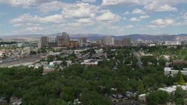 5.7K aerial stock footage flyby hotels and casinos of the city's skyline, and descend toward the trees in Reno, Nevada Aerial Stock Footage | DX0001_004_043