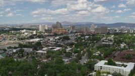 5.7K aerial stock footage of a reverse view of hotels and casinos of the city's skyline in Reno, Nevada Aerial Stock Footage | DX0001_004_046