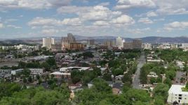 5.7K aerial stock footage of a reverse view of the hotels and casino resorts of Reno, Nevada Aerial Stock Footage | DX0001_004_052