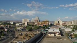 5.7K aerial stock footage of following train tracks toward casino resorts in Reno, Nevada Aerial Stock Footage | DX0001_005_001
