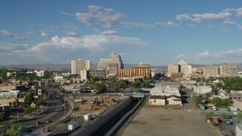 5.7K aerial stock footage of following train tracks toward the city skyline in Reno, Nevada Aerial Stock Footage | DX0001_005_003