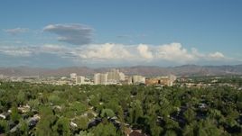 5.7K aerial stock footage of ascending from Lake Park to reveal the city skyline in Reno, Nevada Aerial Stock Footage | DX0001_005_007