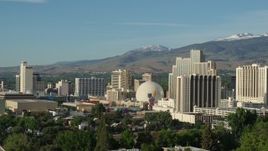 5.7K aerial stock footage of flying by a group of casino resorts in Reno, Nevada Aerial Stock Footage | DX0001_006_002