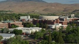5.7K aerial stock footage of flying by buildings on the campus of the University of Nevada in Reno, Nevada Aerial Stock Footage | DX0001_006_007