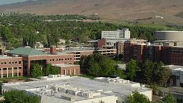 5.7K aerial stock footage of passing the campus of the University of Nevada in Reno, Nevada Aerial Stock Footage | DX0001_006_008