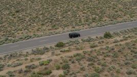 5.7K aerial stock footage of tracking a black SUV on a desert road in Carson City, Nevada Aerial Stock Footage | DX0001_007_019