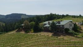 5.7K aerial stock footage of a hilltop home overlooking Phelps Creek Vineyards in Hood River, Oregon Aerial Stock Footage | DX0001_009_018