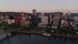 4K aerial stock footage flying by the downtown skyline, Hawthorne Bridge at sunrise, Downtown Portland, Oregon Aerial Stock Footage | DX0001_010_004