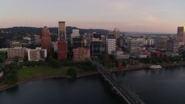4K aerial stock footage of downtown buildings and the Hawthorne Bridge at sunrise, Downtown Portland, Oregon Aerial Stock Footage | DX0001_010_006