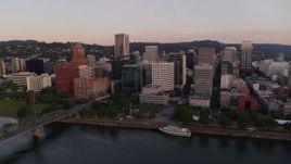 4K aerial stock footage of the downtown skyline and Hawthorne Bridge at sunrise, Downtown Portland, Oregon Aerial Stock Footage | DX0001_010_007