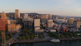 4K aerial stock footage flying over Hawthorne Bridge at sunrise, approaching Downtown Portland, Oregon Aerial Stock Footage | DX0001_010_015