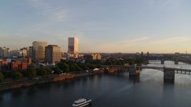 4K aerial stock footage approaching the Morrison Bridge spanning Willamette River near Downtown Portland, Oregon Aerial Stock Footage | DX0001_010_019