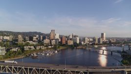4K aerial stock footage flying away from Riverplace Marina and over Marquam Bridge, Downtown Portland, Oregon Aerial Stock Footage | DX0001_010_033