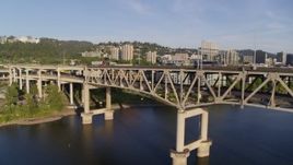 4K aerial stock footage tracking traffic on lower deck of Marquam Bridge, Downtown Portland, Oregon Aerial Stock Footage | DX0001_010_036