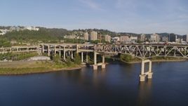 4K aerial stock footage away from Marquam Bridge, I-5, over Willamette River, Downtown Portland, Oregon Aerial Stock Footage | DX0001_010_037
