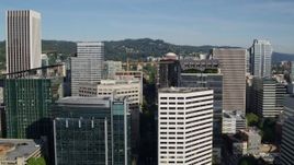 5.7K aerial stock footage flying by downtown skyscrapers on a partly cloudy day, Downtown Portland, Oregon Aerial Stock Footage | DX0001_011_016