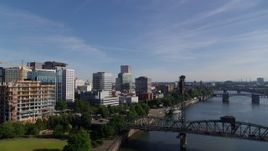 5.7K aerial stock footage flying away from office buildings revealing Hawthorne Bridge, Downtown Portland, Oregon Aerial Stock Footage | DX0001_011_029