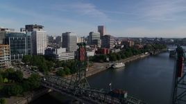 5.7K aerial stock footage flyby waterfront office buildings and over Hawthorne Bridge, Downtown Portland, Oregon Aerial Stock Footage | DX0001_011_033