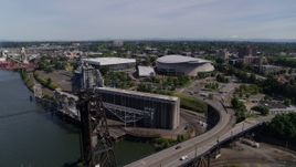 5.7K aerial stock footage of Moda Center and Veterans Memorial Coliseum from Steel Bridge, Northeast Portland, Oregon Aerial Stock Footage | DX0001_012_006