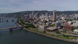 5.7K aerial stock footage reverse and fly over Willamette River from Downtown Portland, Oregon Aerial Stock Footage | DX0001_012_012