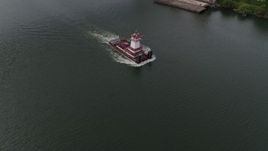5.7K aerial stock footage tracking a tugboat in the river, North Portland, Oregon Aerial Stock Footage | DX0001_013_004