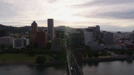 5.7K aerial stock footage of the setting sun behind the downtown skyline, sunset, Downtown Portland, Oregon Aerial Stock Footage | DX0001_014_003