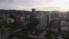 5.7K aerial stock footage of downtown office buildings near the river at sunset, Downtown Portland, Oregon Aerial Stock Footage | DX0001_014_011