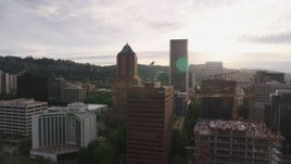5.7K aerial stock footage of city buildings near the river at sunset, Downtown Portland, Oregon Aerial Stock Footage | DX0001_014_012
