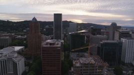 5.7K aerial stock footage side view of Downtown Portland office buildings and skyscrapers at sunset, Oregon Aerial Stock Footage | DX0001_014_016