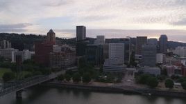 5.7K aerial stock footage of Downtown Portland skyline seen from Willamette River at twilight, Oregon Aerial Stock Footage | DX0001_014_023