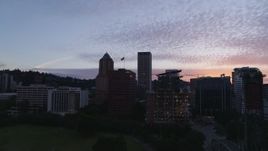 5.7K aerial stock footage descending over the Willamette River with a view of Downtown Portland, Oregon at twilight Aerial Stock Footage | DX0001_014_031