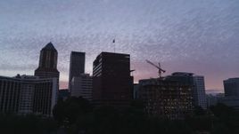 5.7K aerial stock footage of flying low away from office buildings in Downtown Portland, Oregon, twilight Aerial Stock Footage | DX0001_014_032