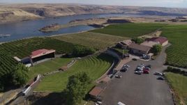 5.7K aerial stock footage orbit the Maryhill Winery, amphitheater, and vineyards beside the Columbia River in Goldendale, Washington Aerial Stock Footage | DX0001_018_009