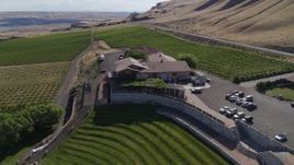5.7K aerial stock footage of a reverse view of the Maryhill Winery and amphitheater in Goldendale, Washington Aerial Stock Footage | DX0001_018_016