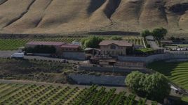 5.7K aerial stock footage of passing the Maryhill Winery in Goldendale, Washington Aerial Stock Footage | DX0001_018_022