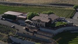 5.7K aerial stock footage of flying away from the buildings at the Maryhill Winery in Goldendale, Washington Aerial Stock Footage | DX0001_018_026