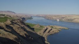 5.7K aerial stock footage flyby the Columbia River to reveal Maryhill Winery and vineyard in Goldendale, Washington Aerial Stock Footage | DX0001_019_005